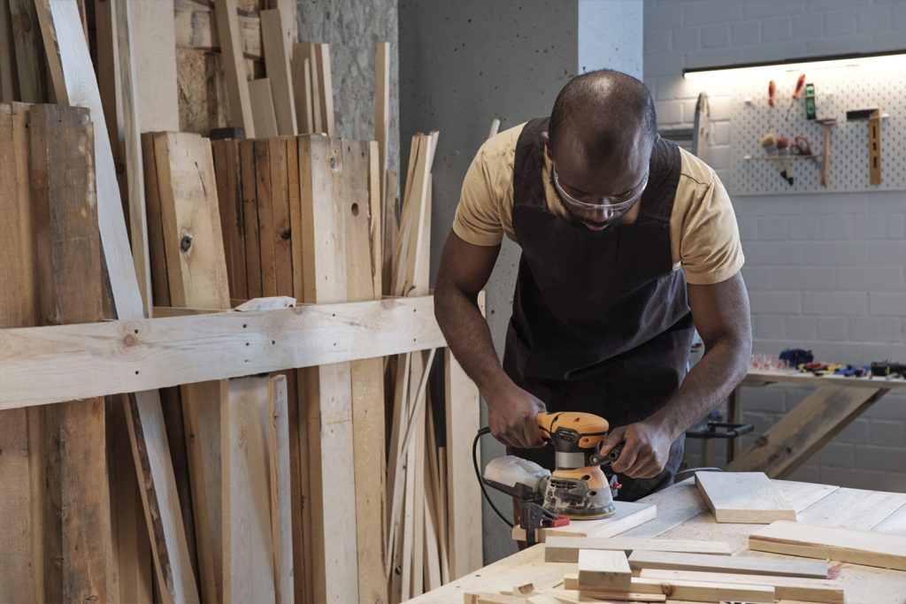 Carpenter working on wood furniture